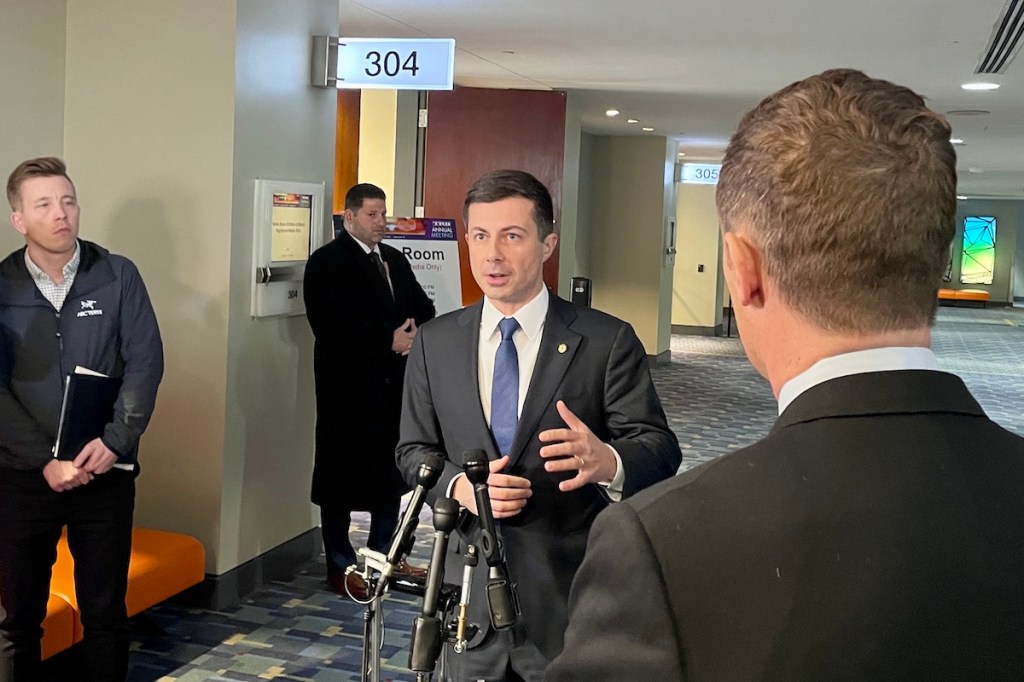 Transportation Secretary Pete Buttigieg speaks to reporters
