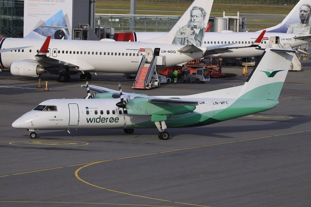 Wideroe and Norwegian Air planes at the Oslo Airport